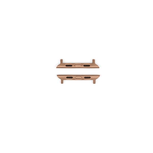 Rose-gold watch band adapters, top and bottom connector pieces showing central release slot and lugs.