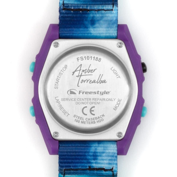 Back of Freestyle Shark Classic Clip Reflection featuring a blue strap, purple case, and Amber Torrealba’s signature.