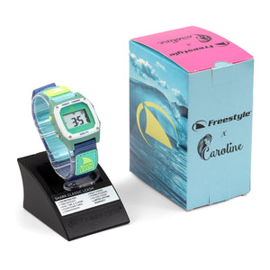 The Freestyle Caroline Marks Signature Shark Classic Leash Melbourne watch shines by a wave box, ideal for surf vibes.