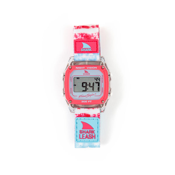 Freestyle’s Caroline Marks Shark Classic Leash Surfin USA watch features a pink/blue tie-dye strap and a square digital display.