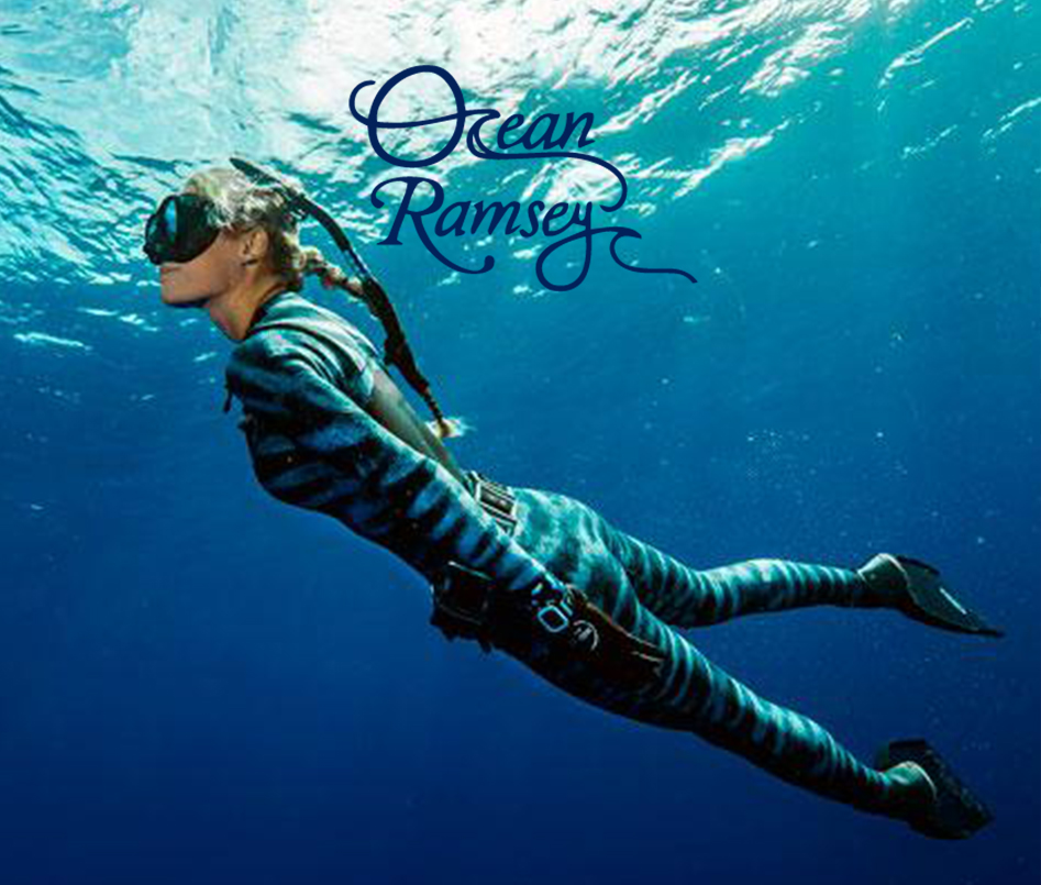 A diver in a striped wetsuit swimming underwater with the text 'Ocean Ramsey' above.